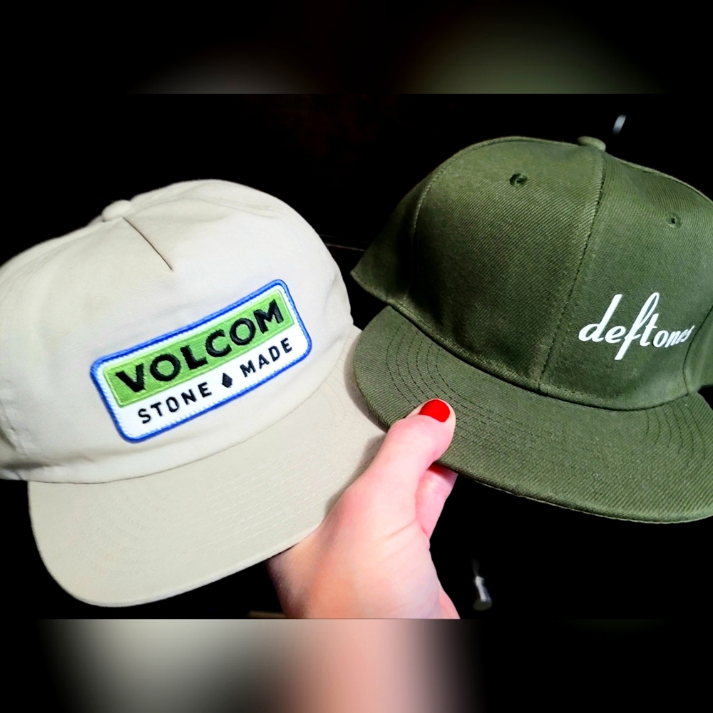 1 genuine Volcom and 1 deftones Snapback hat.